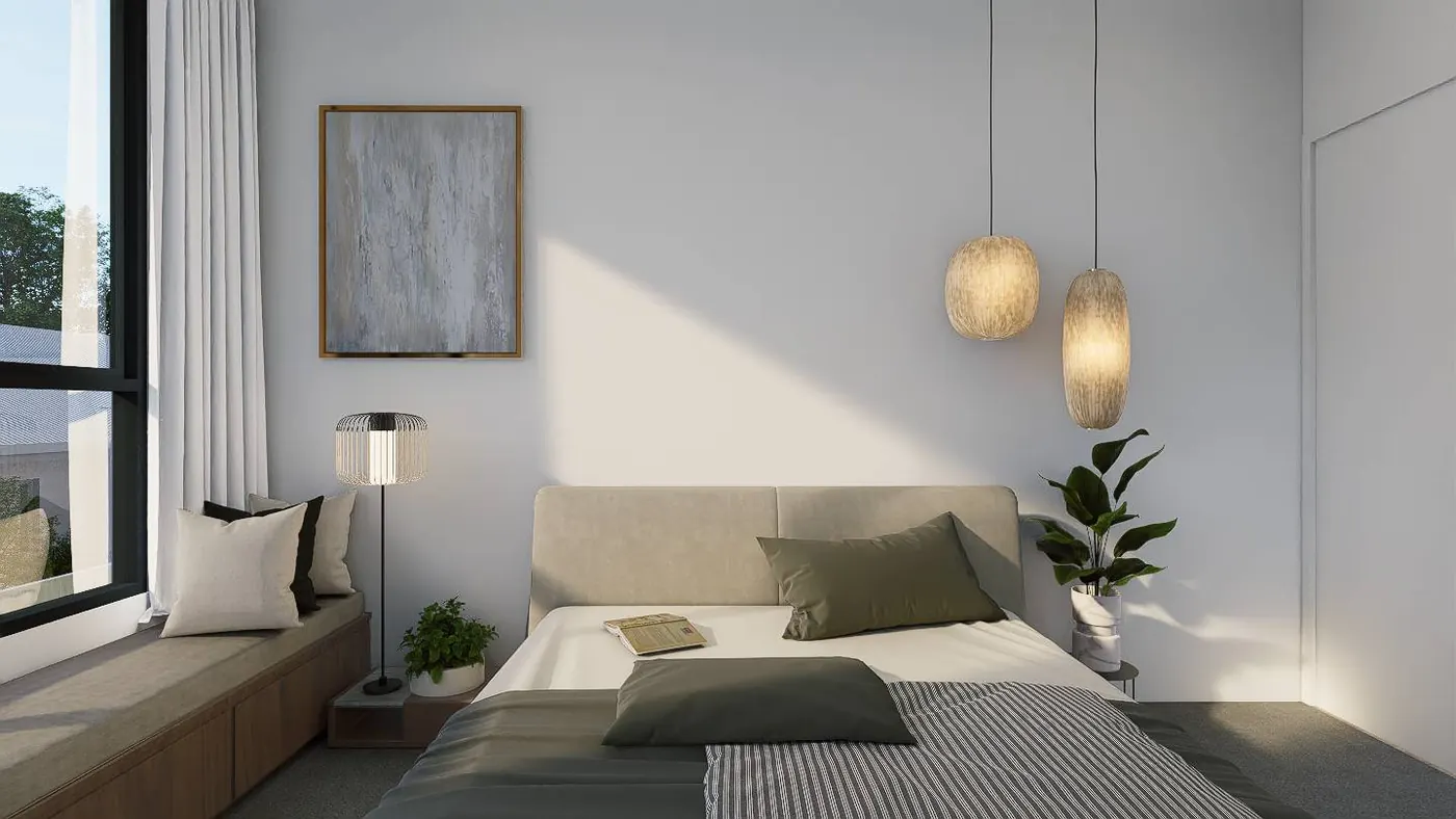 A main bedroom with a built-in timber window seat, tall black-framed window and pendant lighting.
